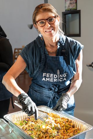 Connie Britton, who volunteered with Feeding America in Los Angeles last weekend with her son, his best friend, and the friend Union Station Homeless Services Connie Britton.