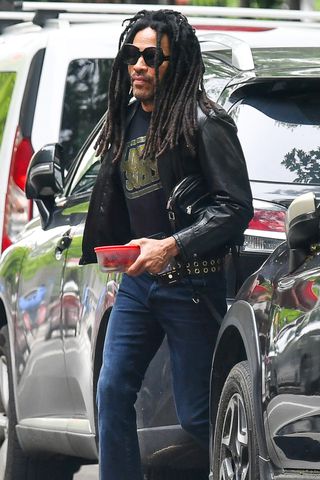 Lenny Kravitz keeps things cool as he steps out with his Tupperware lunch container in New York City TheImageDirect.com Lenny Kravitz